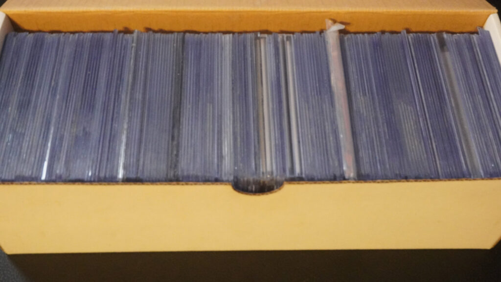 toploaded cards inside a toploader storage box